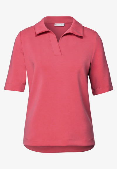 Pink polo shirt on a white background