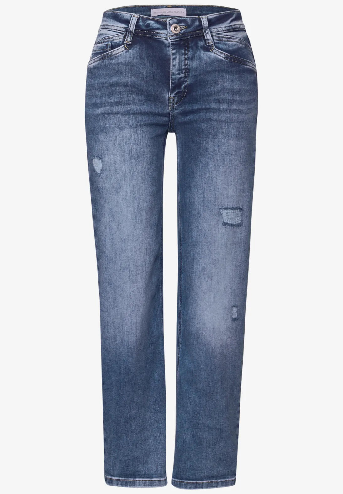 Blue jeans with slight distressing on a white background