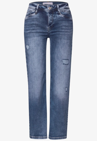 Blue jeans with slight distressing on a white background