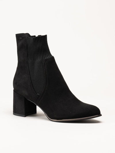 Black ankle boot on a white background