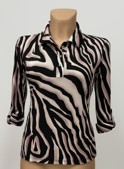 Zebra print shirt on a mannequin against a plain background