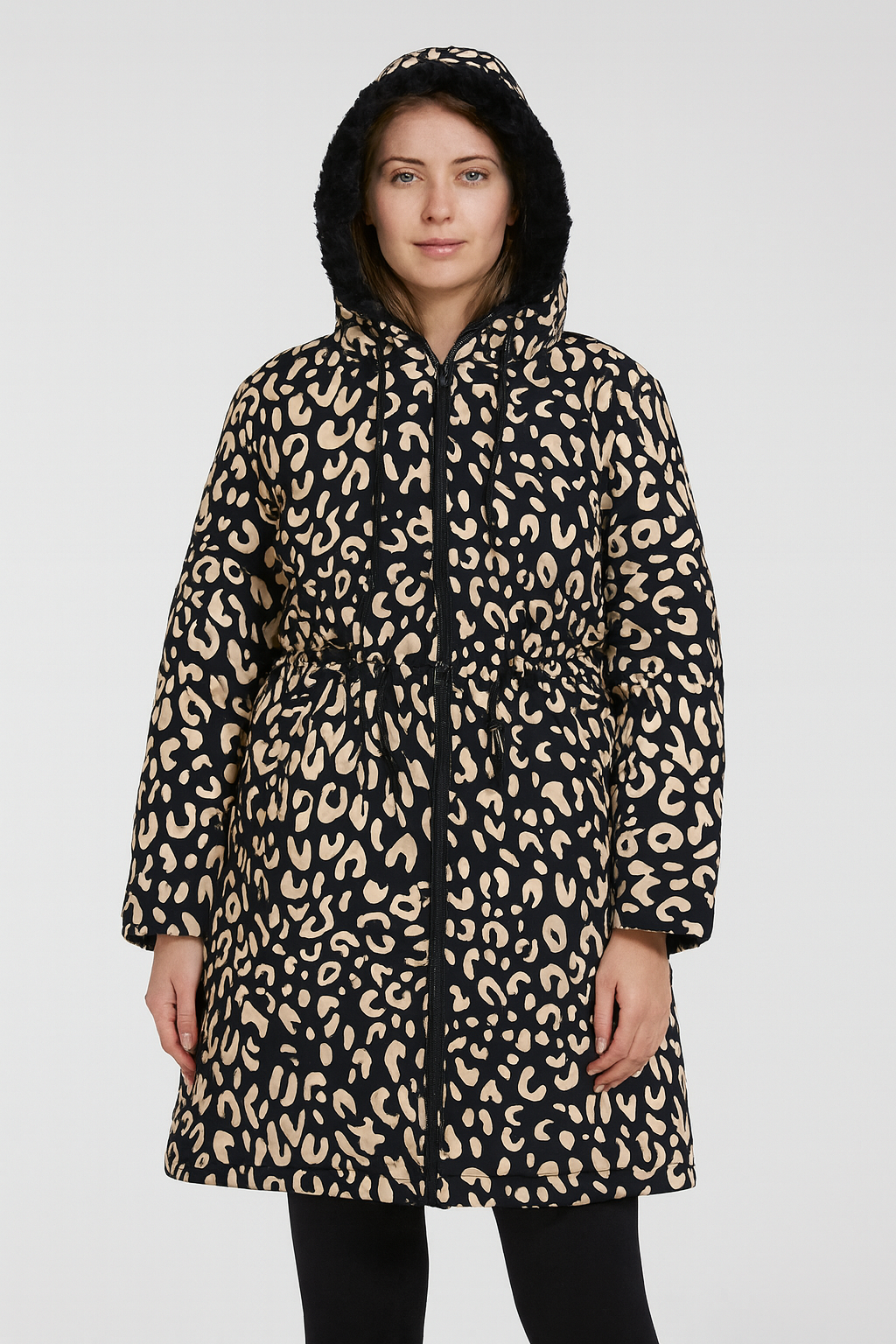 Person wearing a leopard print coat on a white background