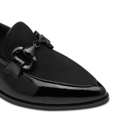 Black patent leather loafer with a decorative buckle on a white background