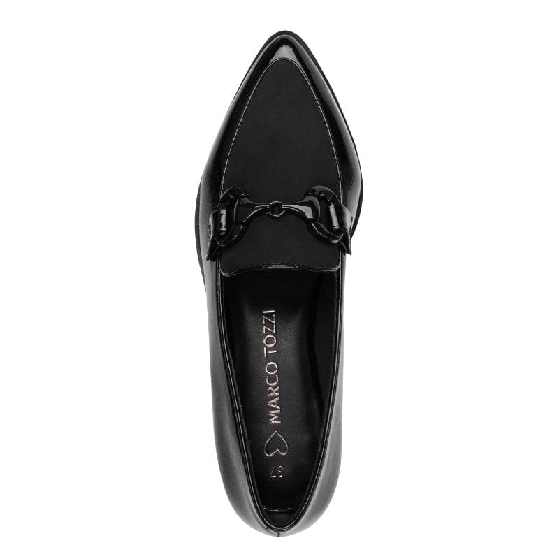 Black patent leather loafer with decorative buckle on a white background