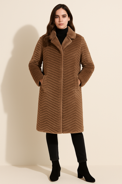 Woman wearing a brown coat against a beige background