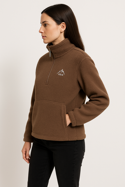 Woman wearing a brown fleece pullover with a logo on a white background