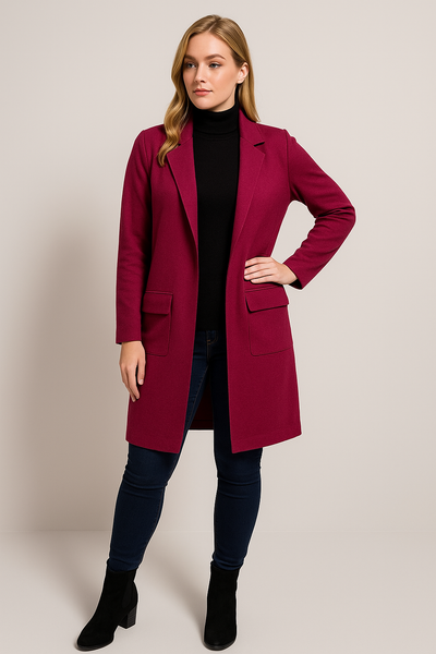Woman wearing a red coat on a plain background