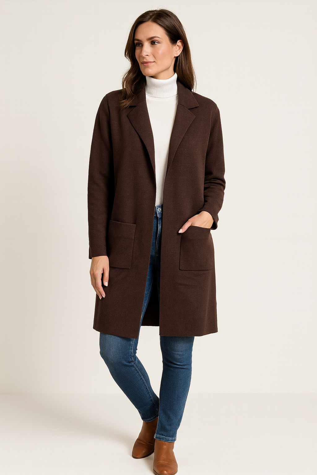 Woman wearing a brown coat on a white background