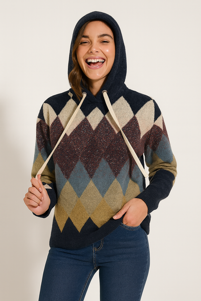 Person wearing a patterned hoodie with a plain background