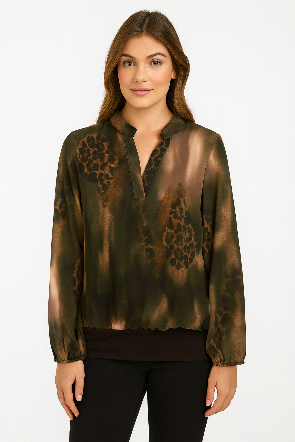 Woman wearing a green blouse with leopard print details on a white background