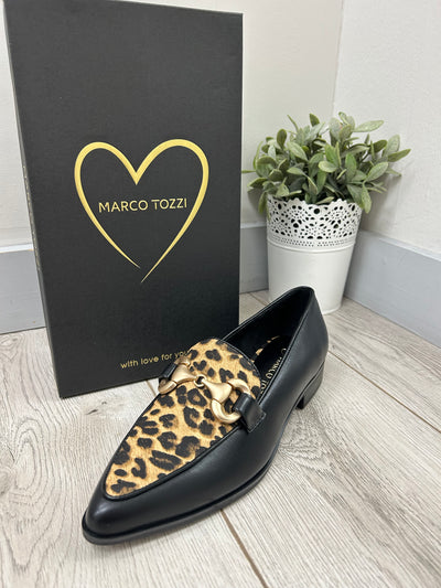 Black loafer with leopard print pattern on a Marco Tozzi branded box.