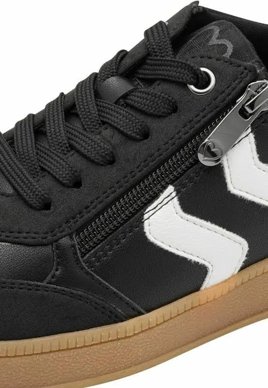 Black sneaker with white zigzag pattern and visible zipper on a white background