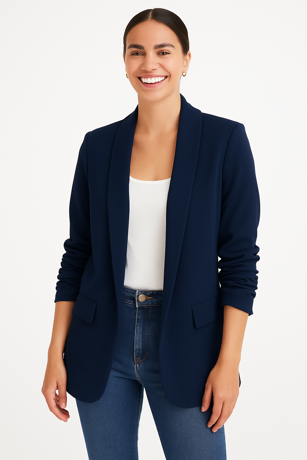 Woman wearing a navy blazer over a white top and blue jeans on a white background