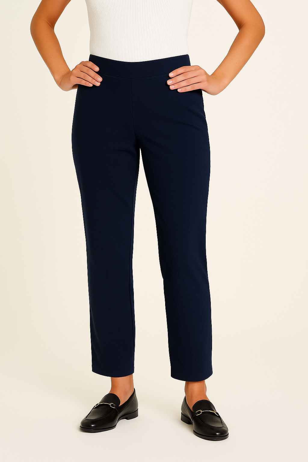 Navy blue pants worn by a person on a beige background