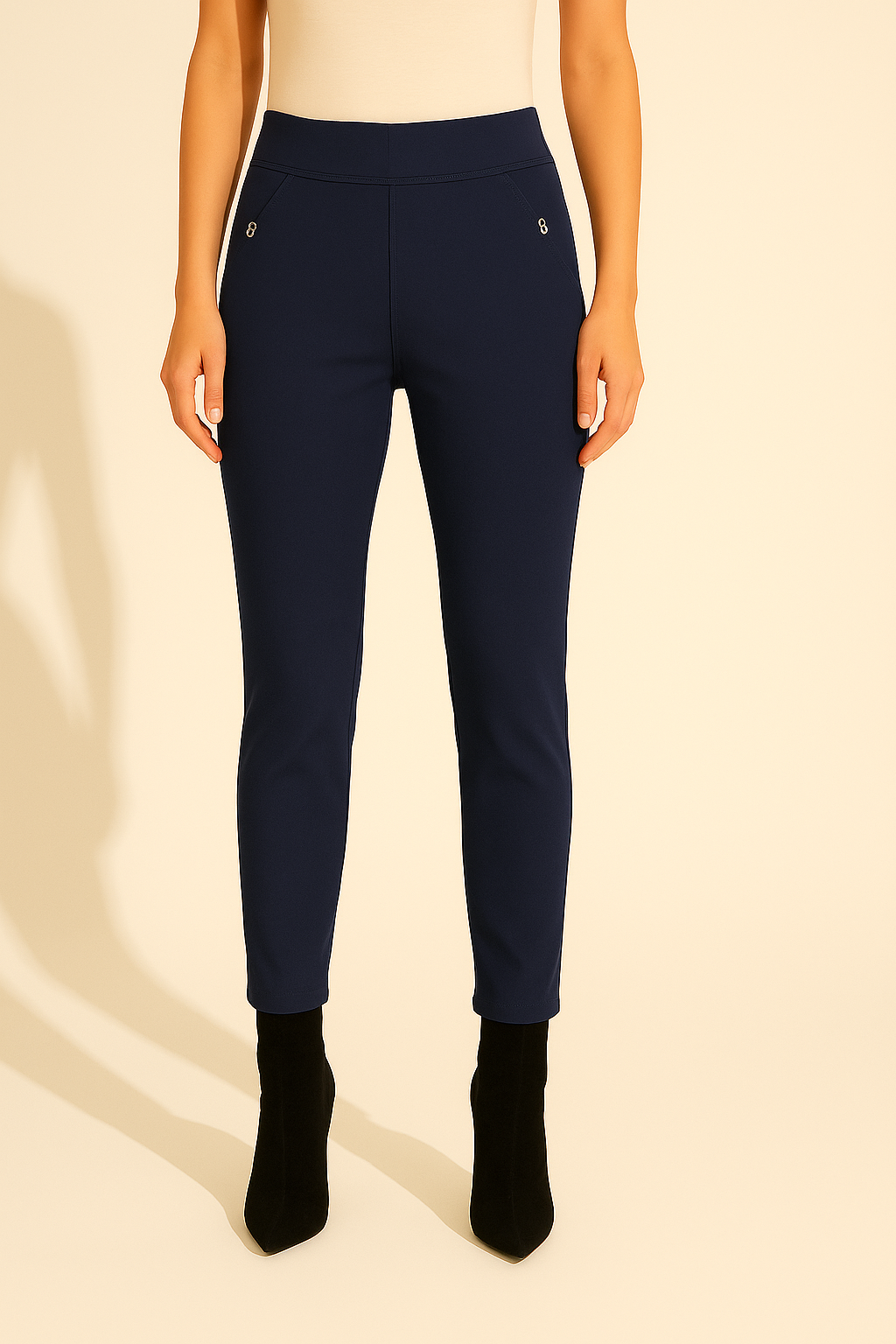 Navy blue pants worn by a person on a beige background