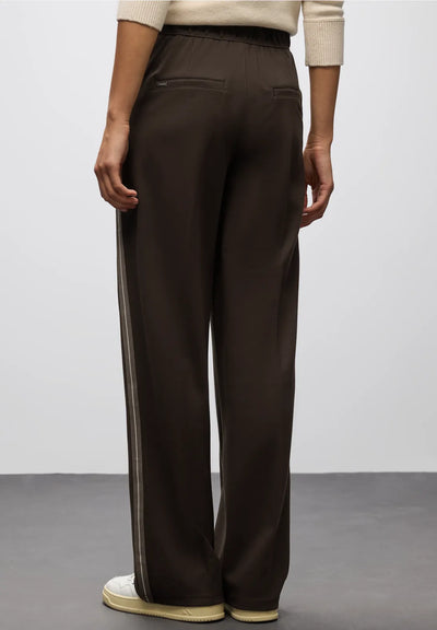Brown wide-leg pants worn by a person on a plain background