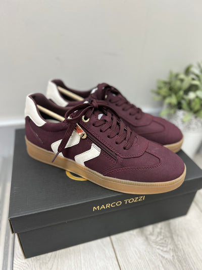Maroon sneakers with white accents on a black Marco Tozzi box.