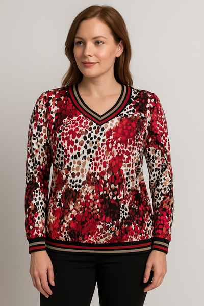 Woman wearing a red and black patterned sweater on a gray background
